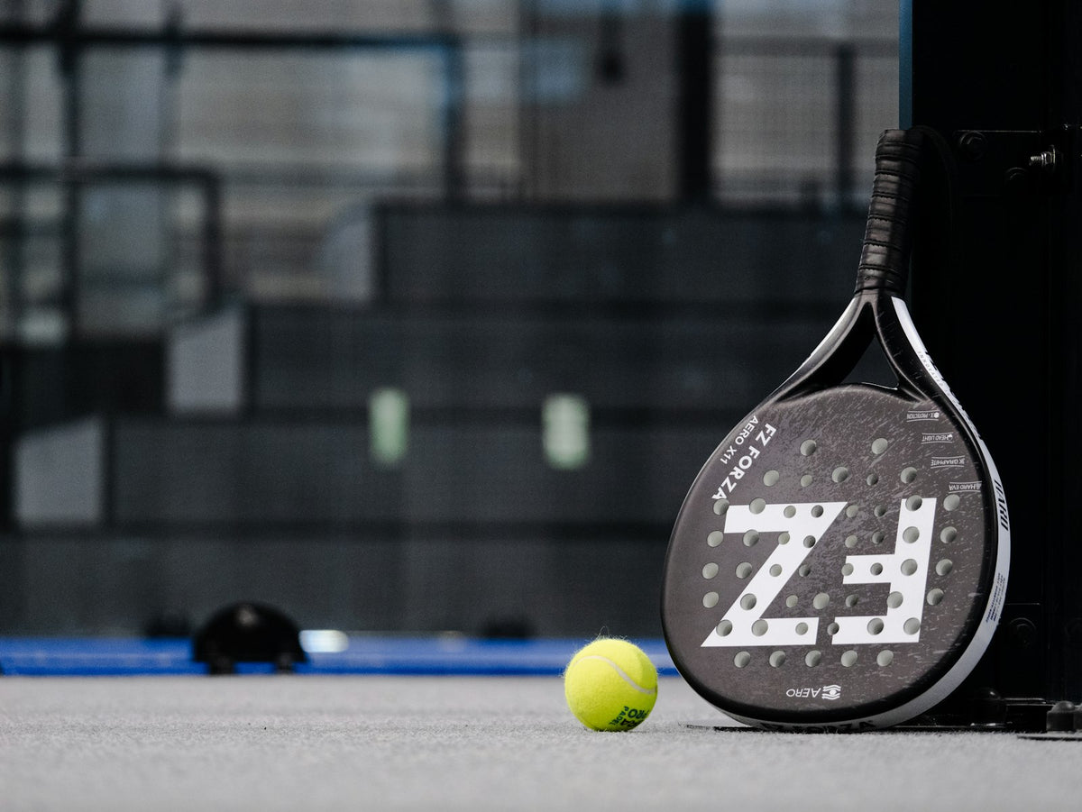 Stock placeholder: padel racket and ball on a court